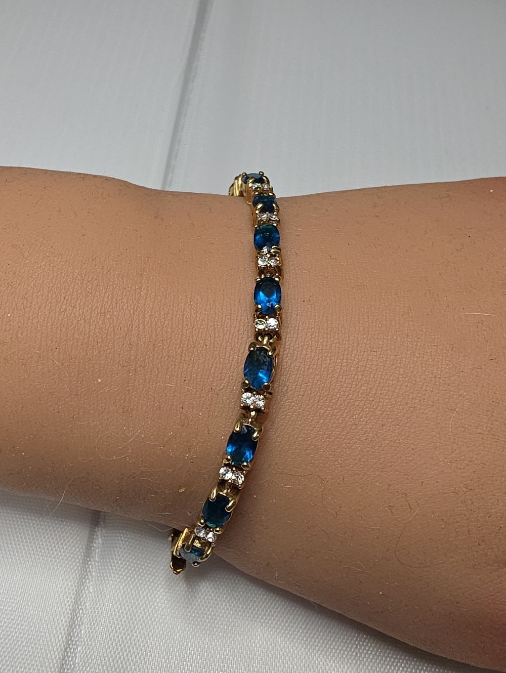 Avon Gold Bracelet with Blue and Clear Stones